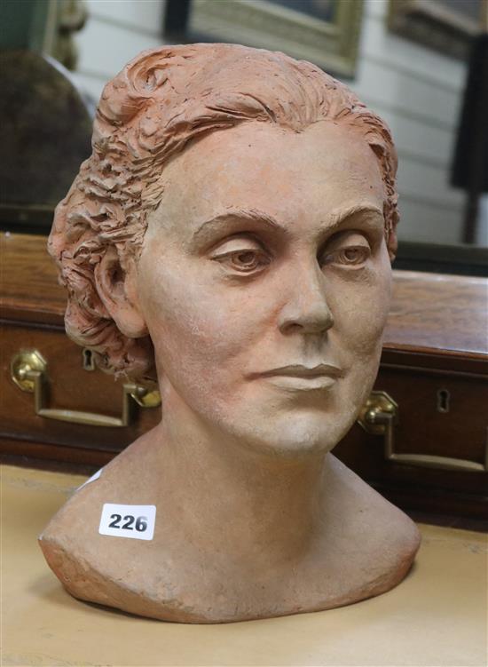 A terracotta head of a woman, signed Nilli Soukop 1943-44 height 31.5cm